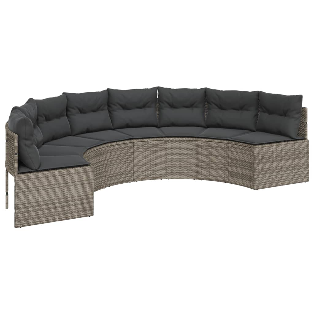 Pilka pusapvalė sodo sofa su stalu ir pagalvėlėmis