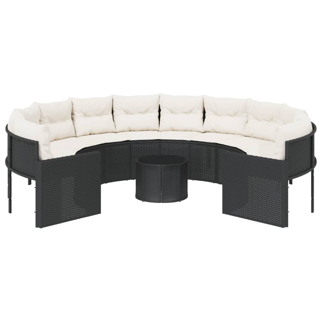 Juoda poliratano sodo sofa su stalu ir pagalvėlėmis