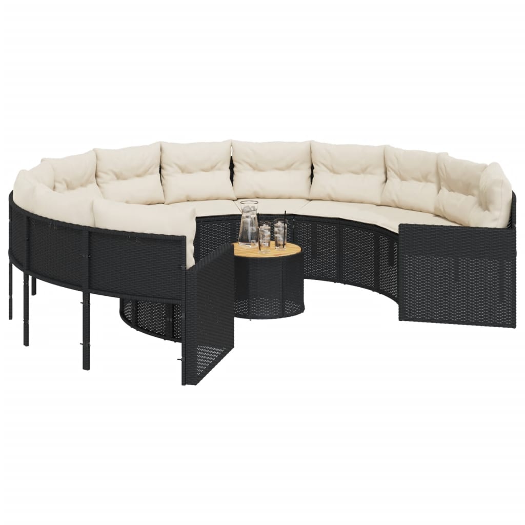 Juoda apvali sodo sofa su stalu ir pagalvėlėmis
