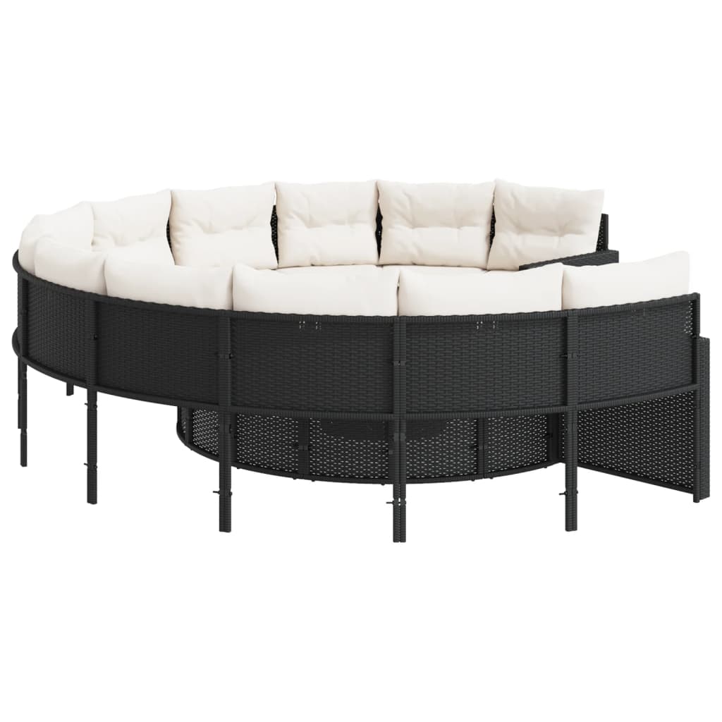 Juoda apvali sodo sofa su stalu ir pagalvėlėmis