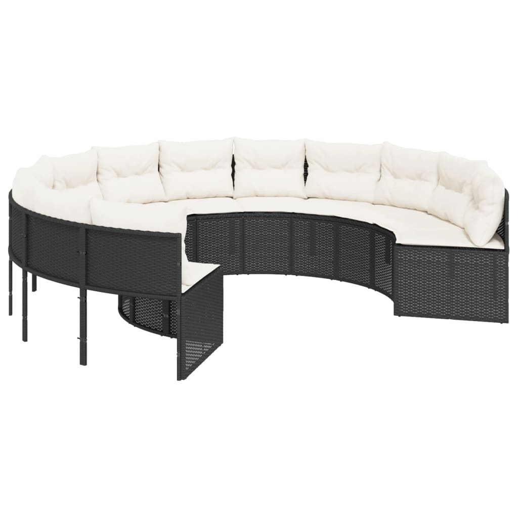 Juoda apvali sodo sofa su stalu ir pagalvėlėmis