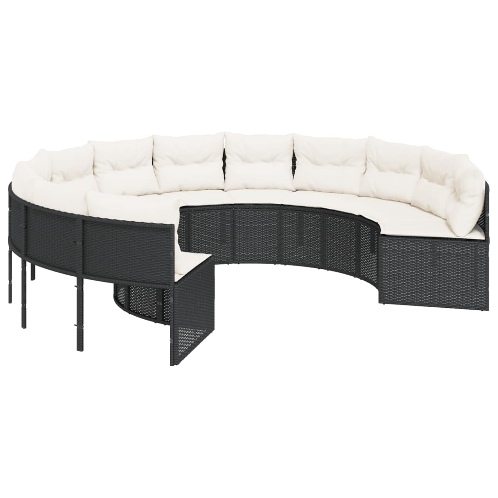 Juoda poliratano sodo sofa su apvaliu stalu ir pagalvėlėmis